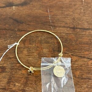 Gold-Tone Bangle Bracelet with Pisces Charms